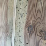 reen stains on old floorboards